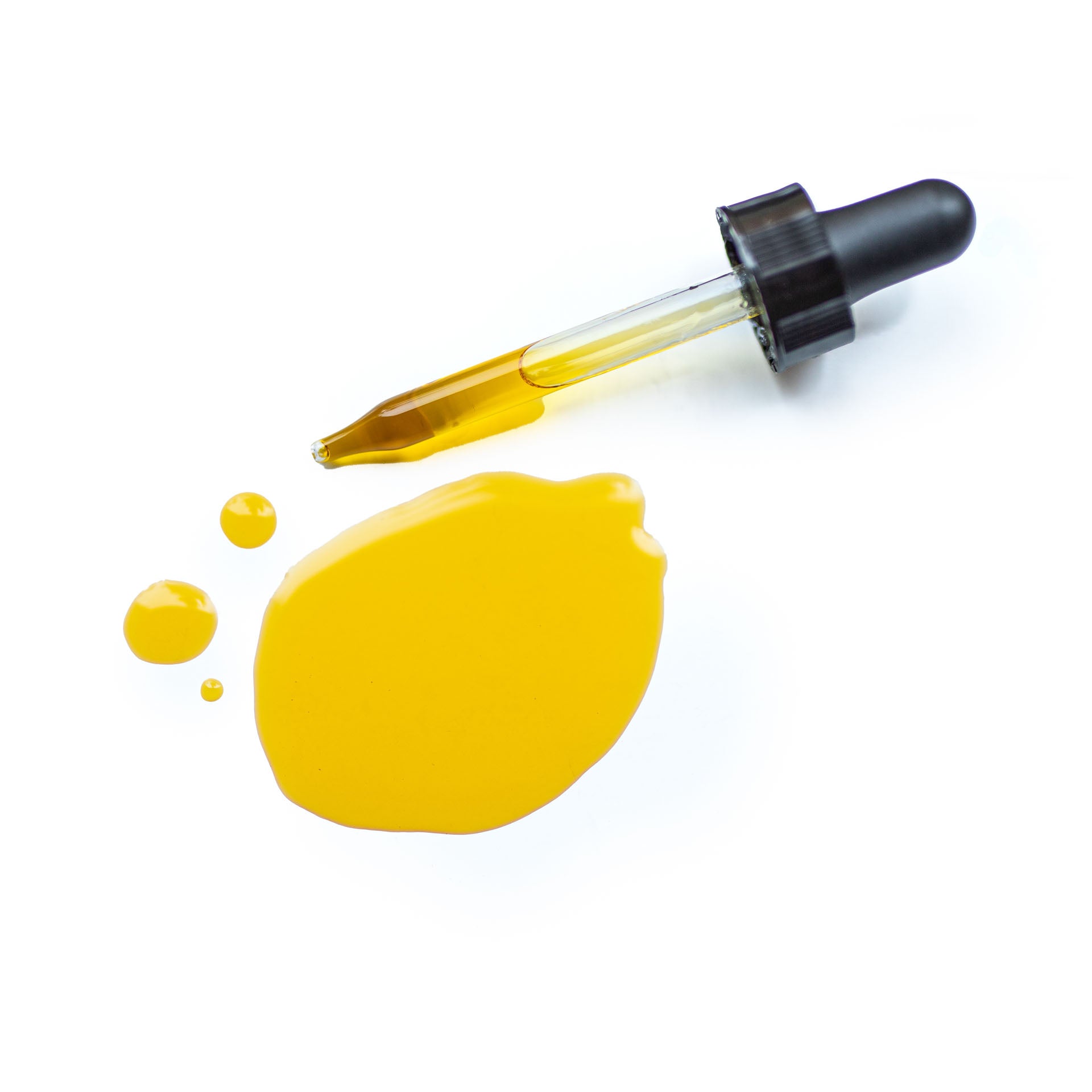 Dropper of Caraline Skincare Daily Nourish Face Oil with oil on a white background