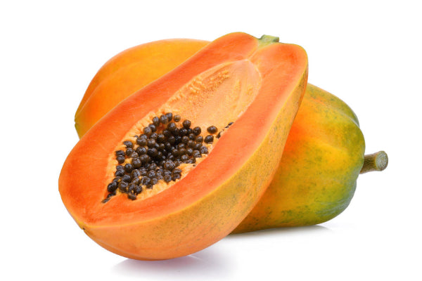 Papaya fruit sliced in half with seeds