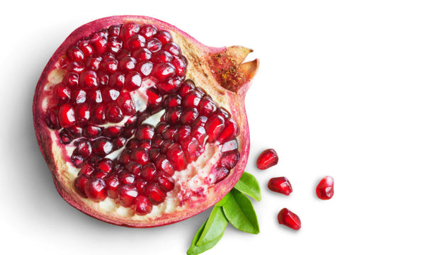 Pomegranate fruit cut in half with seeds