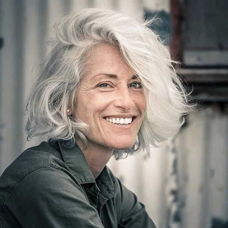 Stylish older woman with gray hair looking at camera