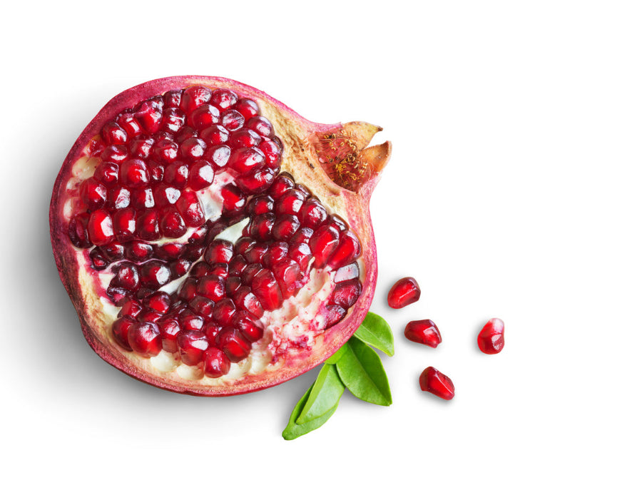 Pomegranate fruit cut in half with seeds