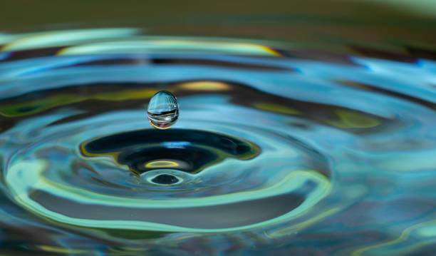 Droplet of water hitting a larger body of water